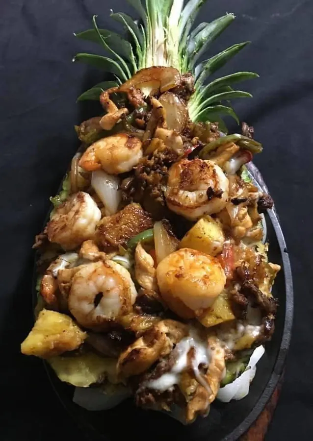 Crazy Kendra: shrimp, steak and pineapple served in a pineapple